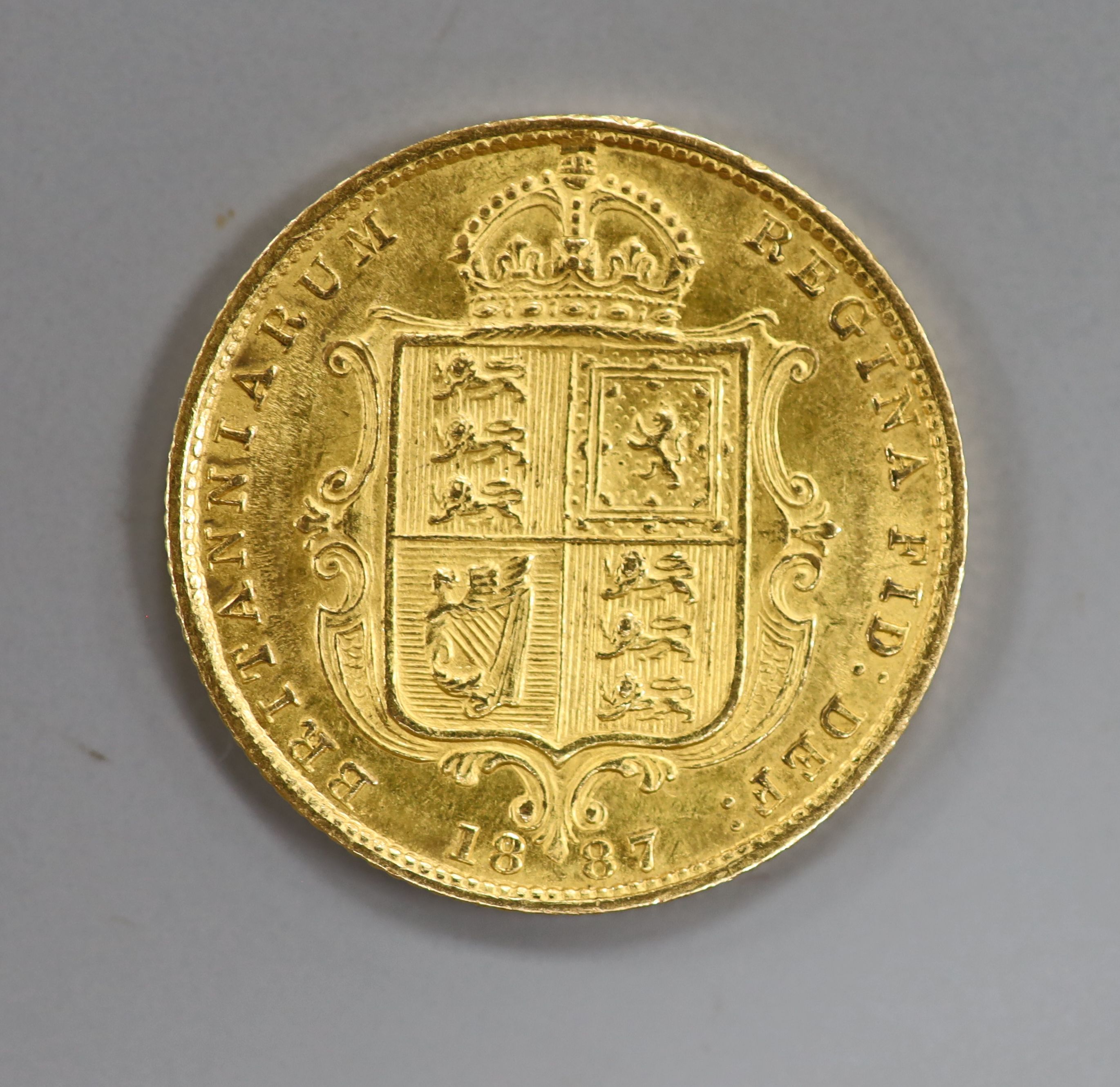 A Victoria 1887 gold half sovereign.